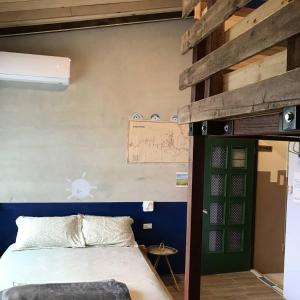 Cama o camas de una habitación en 池上5159懷舊民宿 請勿用阿勾達訂房