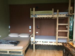 Cama o camas de una habitación en 池上5159懷舊民宿 請勿用阿勾達訂房