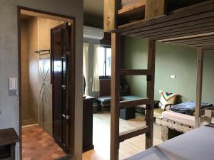 Cama o camas de una habitación en 池上5159懷舊民宿 請勿用阿勾達訂房