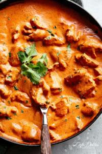 a pan of food with a spoon in it at Shanti Jungle cottage in Mashobra