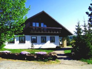 a large house with a black and white at Landgasthof Heldenberg in Nenningen