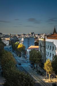 a view of a city with a street and buildings at "34" Apartment in Belgrade
