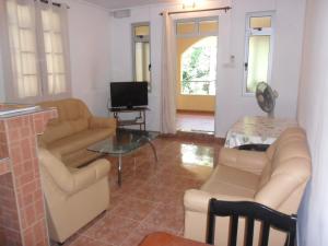 a living room with a couch and a table at Sunway Residence in Mont Choisy