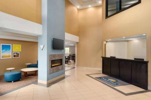 a lobby with a fireplace and a waiting room at Days Inn by Wyndham Tamworth in Tamworth