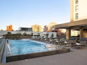 a swimming pool on the roof of a building at Novotel Vina del Mar in Viña del Mar