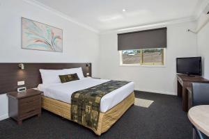 Postel nebo postele na pokoji v ubytování Comfort Hotel Dandenong