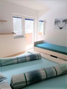 Postel nebo postele na pokoji v ubytování Appartementhaus Gleirscher
