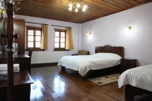 Postel nebo postele na pokoji v ubytování Manis Hotel