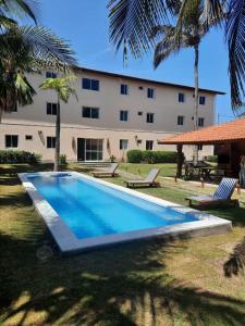 a swimming pool in front of a building at Pecem Beach Hotel - Aval Hotel in Pecém
