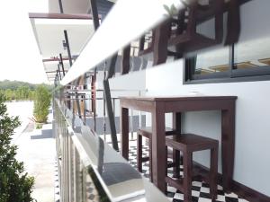 Balkón nebo terasa v ubytování เดอะเบสรีสอร์ทพัทลุง