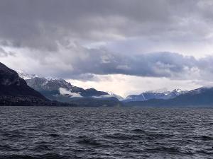 a large body of water with mountains in the background at Le lavoir in Rumilly +9 photos
