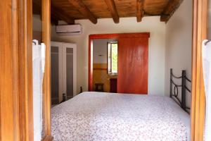 Posteľ alebo postele v izbe v ubytovaní B&B Al Vecchio Confine
