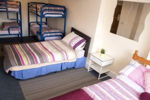 Postel nebo postele na pokoji v ubytování Sive Budget Accommodation