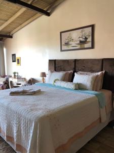Giường trong phòng chung tại Pousada Vista ao Farol