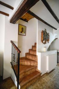 a staircase in a house with wooden floors and wooden beams at LA CASICA in Segorbe