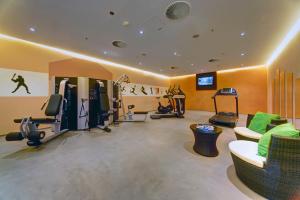 a fitness room with a gym with tread machines at Hanse Hotel Attendorn in Attendorn