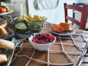 a table topped with bowls of fruit and other foods at B&B La Terrazza di NonnAnna in Taranto