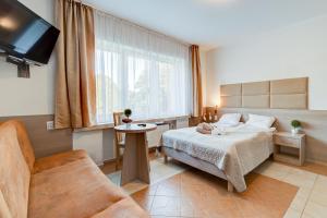 Posteľ alebo postele v izbe v ubytovaní Ambre Mare - Wypoczynek pod Palmami
