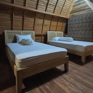 Tempat tidur dalam kamar di Villa Lumbung Salak