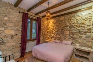 Postel nebo postele na pokoji v ubytování Casa Rural Cortijo Pesquera