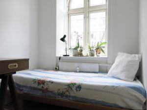 A bed or beds in a room at ApartmentInCopenhagen Apartment 1288