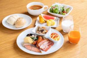 
a white plate topped with different types of food at Lime Resort Myoko in Myoko
