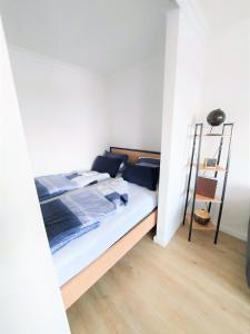 Ένα ή περισσότερα κρεβάτια σε δωμάτιο στο Ferienwohnung Seestern 78