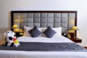 Letto o letti in una camera di Amaranthe Bay Resort & Spa