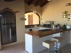A kitchen or kitchenette at VILLA VISTA MARE INFINITY POOL