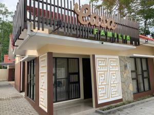 a building with a balcony on top of it at Casa Familia Syariah in Sleman