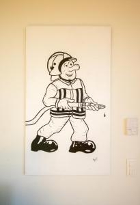 Un disegno di un uomo che tiene una pistola contro un muro di 't Speutekot a Watou