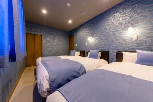 Кровать или кровати в номере 01 Resort Club -結YUI-