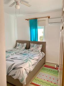 Кровать или кровати в номере Ephesus Holiday House