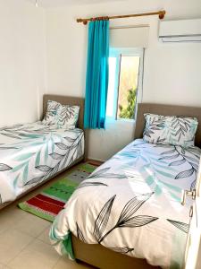 En eller flere senge i et værelse på Ephesus Holiday House