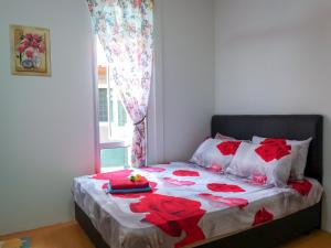 Ένα ή περισσότερα κρεβάτια σε δωμάτιο στο 22 Idaman Homestay