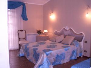 Cama o camas de una habitación en Il Glicine di Carmen