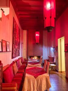 a living room with a couch and a table at Dar Tourkia in Taroudant