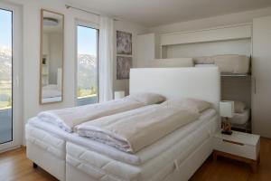 Säng eller sängar i ett rum på Ski In Ski Out Apartment Fastenberg Top 3 by AA Holiday Homes