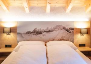 Letto o letti in una camera di Hotel Bergführer