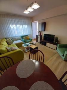 a living room with a couch and a table at TEI in Oradea