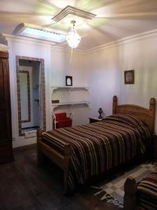 Ένα ή περισσότερα κρεβάτια σε δωμάτιο στο Casa Natalia