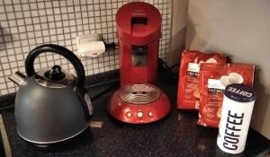 a tea kettle and a coffee maker on a counter at Apartmán v Liliové in Jablonec nad Nisou