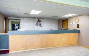 an empty waiting room with a blue counter top at Rodeway Inn in Bonifay