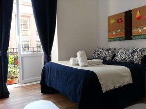 A bed or beds in a room at Casa de Huéspedes Prada