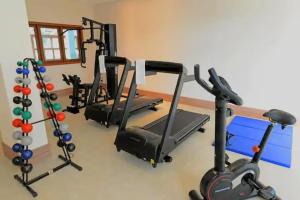 a gym with several treadms and cardio machines at Suite Cond Vista Azul em Pedra Azul - Domingos Martins in Domingos Martins