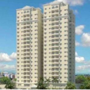 two tall white buildings with trees in front of them at Aconchegante apto em localização privilegiada in Cuiabá