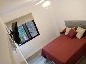 מיטה או מיטות בחדר ב-Apartamento Playa La Arena