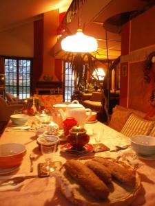 a table with a plate of food on it at B&B Al Roncaccio in Calco