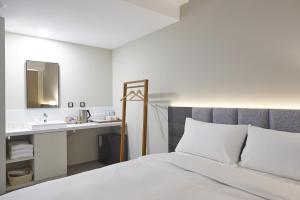 Postel nebo postele na pokoji v ubytování Hotel Z