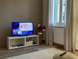 Televízia a/alebo spoločenská miestnosť v ubytovaní CIVICO 57 Al Santo - PADOVA
